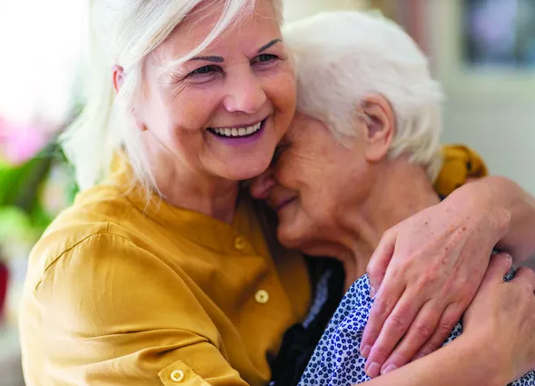 Woman spending time with her elderly mother