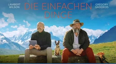 Filmplakat mit zwei Männern und einem Hund vor verschneiter Berglandschaft; darüber der Titel „Die einfachen Dinge“ sowie die Namen Lambert Wilson und Grégory Gadebois.