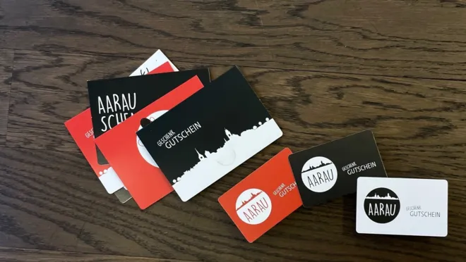 CHF 10.–/Person Aarau Gutschein   (einlösbar im Detailhandel, in Restaurants,   Bars und Freizeitorten)