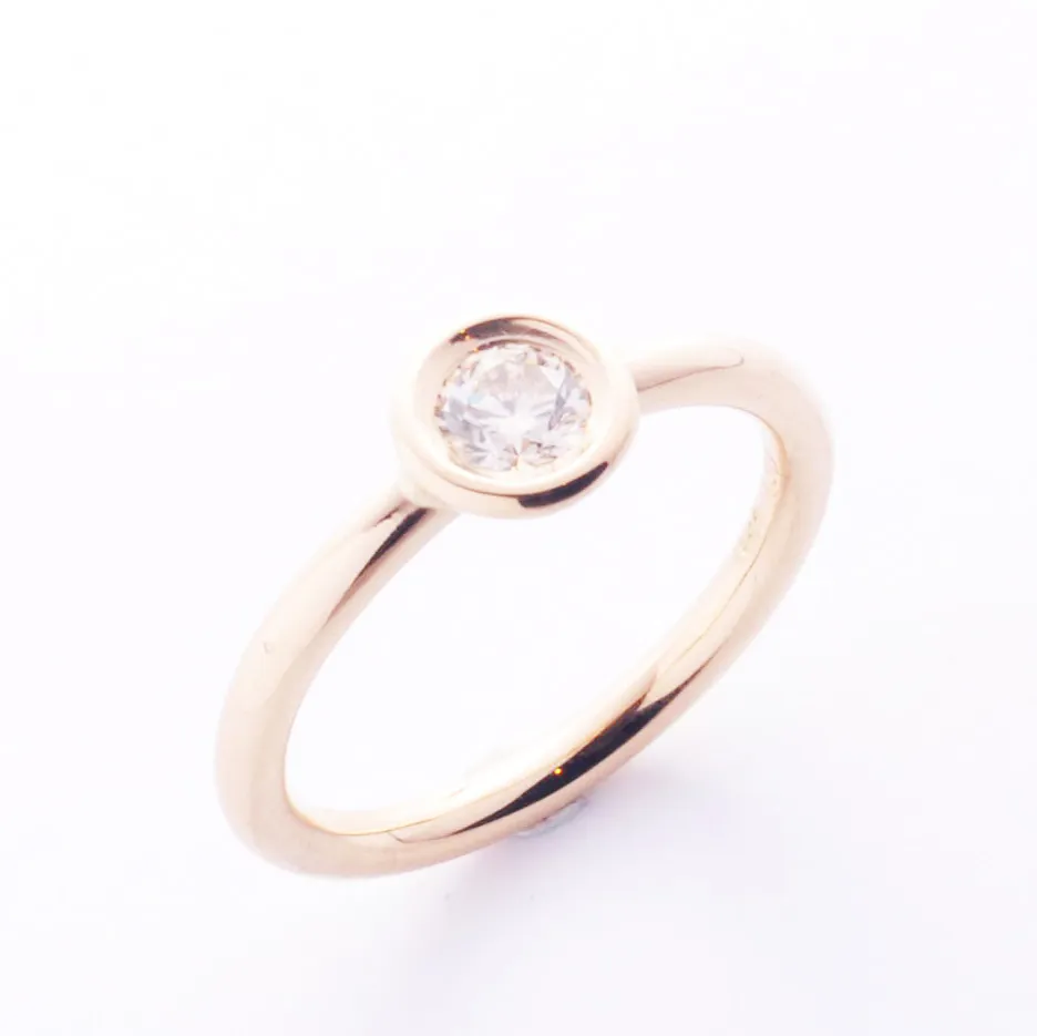 Kreisring Gelbgold mit braunem Brilliant